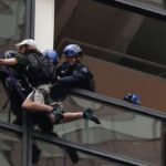 Police arrests a man climbing Trump Tower