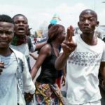 Protests turn violent in Congo capital police officer lynched