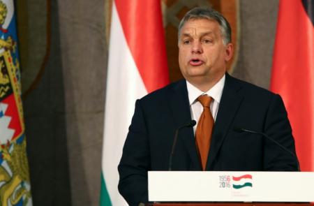 Hungarys PM threatens to sue EU over mandatory migrant quotas