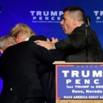 Security hustles Trump from stage after protester displays sign