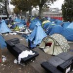 Police clear Paris migrant camp that swelled after Calais closure