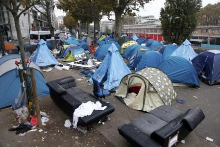 Police clear Paris migrant camp that swelled after Calais closure