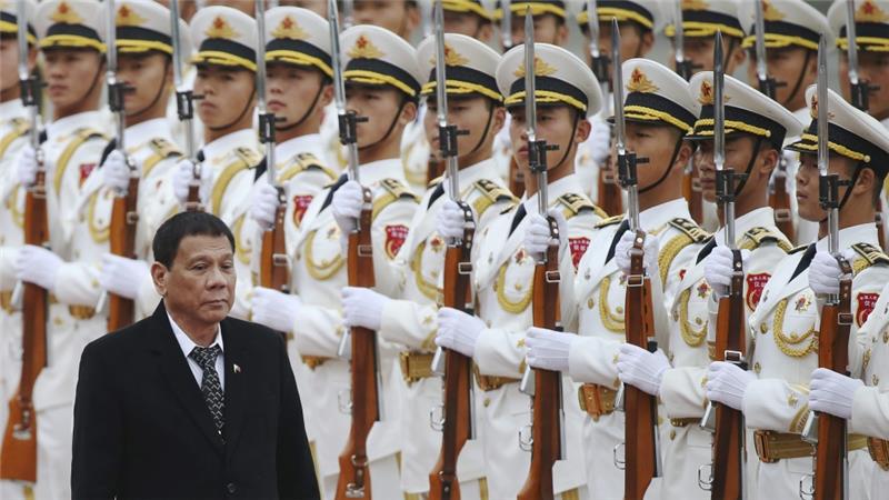 Philippines President Rodrigo Duterte review honour guards during a welcome ceremony at the Great Hall of the People in Beijing October 2016 EPA