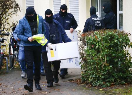 Police raid mosques flats across Germany as government bans Islamist group