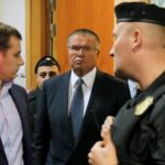 Russias Putin fires economy minister over bribery charges
