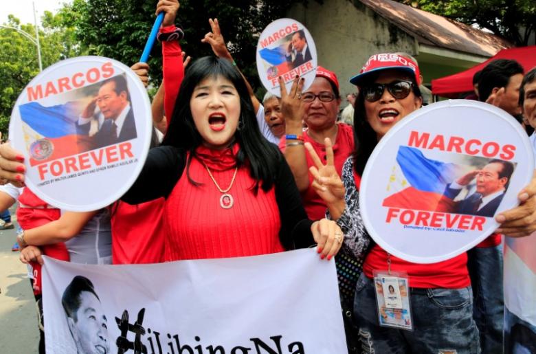 Philippine dictator Marcos buried with military honours at heroes cemetery