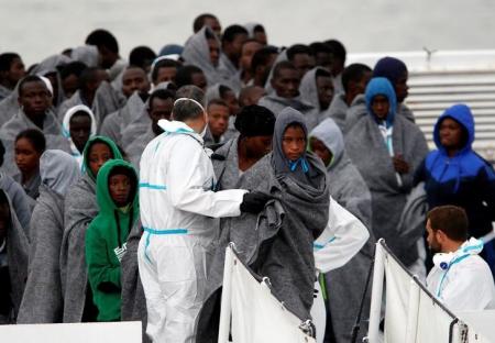 Some 1400 migrants rescued 8 bodies recovered Italy coastguard