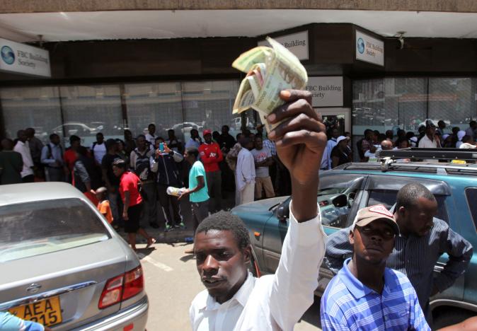 Zimbabwe police use water cannon against fake money protest