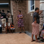 Neighbours gather in shock at Ozoekwe Ezeudu's compound in Mgbakwu -Photo: Uche Ndeke/Radio Nigeria