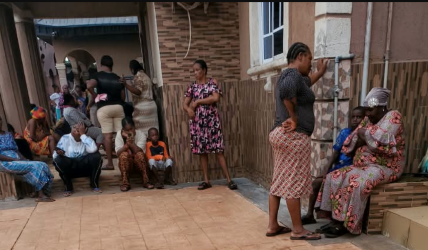 Neighbours gather in shock at Ozoekwe Ezeudu's compound in Mgbakwu -Photo: Uche Ndeke/Radio Nigeria